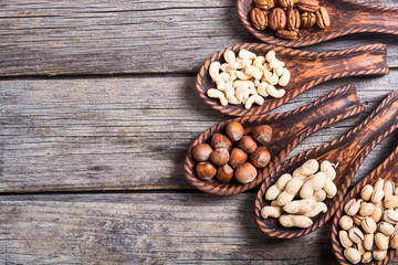 Mix of nuts in wooden spoon