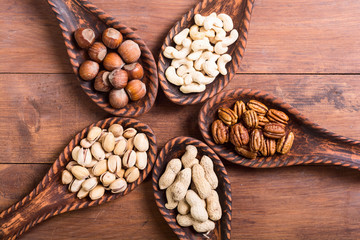 Mix of nuts in wooden spoon