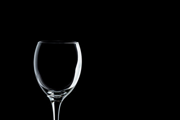 a glass of wine close-up on a black background (isolate).