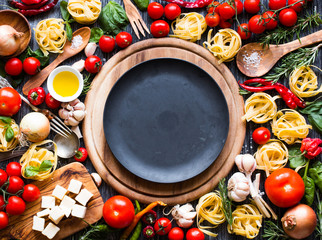 Top view of all the necessary food component to make a classic italian pasta