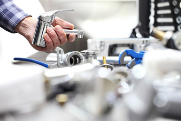 hands plumber at work in a bathroom, plumbing repair service, assemble and install concept