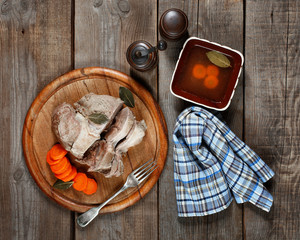 Boiled veal with carrot and seasoning.