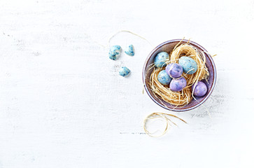 Speckled Easter Eggs in a Ceramic Bowl (flat lay arrangement)