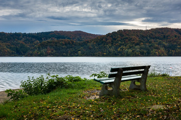 Fototapeta premium Bench by thr Solina lake in Polanczyk, Bieszczady, Poland