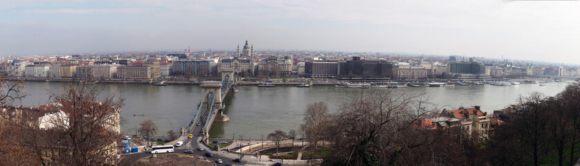large wide panorama of the city of budapest with historic buildings chain bridge and city skyline with boats along the river danube