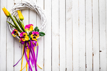 Easter background with spring wreath hanging on door