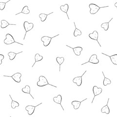 Heart shaped candy seamless pattern with lollipops vintage lineart style. Hand drawing