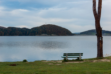 Fototapeta na wymiar Bench by thr Solina lake in Polanczyk, Bieszczady, Poland
