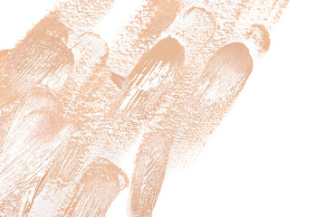Makeup brush strokes of liquid foundation on white with copy space