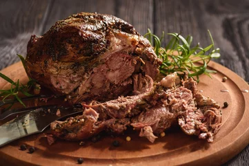 Fotobehang Roasted lamb fillet on wooden background. © O.B.