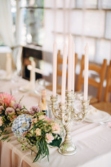 Silver сandelabrum for five candles with peach and blue flowers