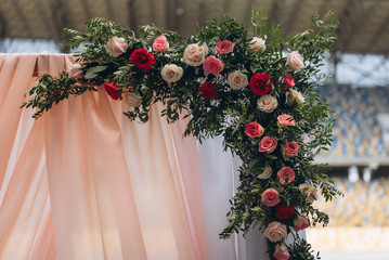 flower arrangement of red, pink and white roses