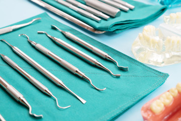 dentist tools and orthodontic on color background, flat lay, top vipw.