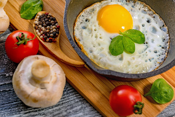 Fried eggs in a frying pan. Rustic breakfast