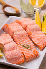 Boiled salmon on white plate. Poached salmon fillet. Good for health diet fish. vertical