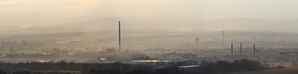 Obraz premium Panoramtic city Ceske Budejovice in winter sunset and strong fog