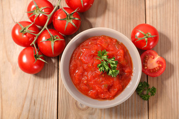 tomato sauce on wood background