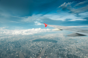 Plane flying above Thailand Bangkok city and Chao Phraya River