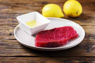 Raw fresh tuna fish on the wooden table