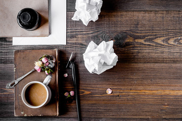 writer workplace with tools on wooden background top view mockup