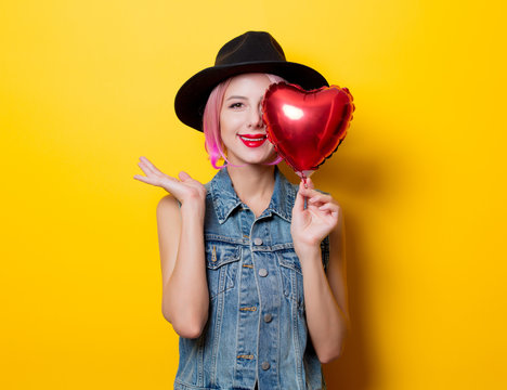 girl with pink hair style with heart shape ballon