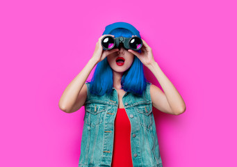 hipster girl with blue hair and binoculars