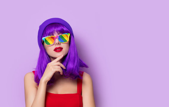 girl with purple hair and rainbow eyeglasses