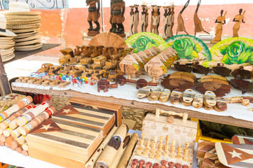 Cuban national flags, cigars, boxes, Che Guevera portraits and other  souvenirs typical for Cuba sold in souvenir shop in street market in Trinidad, Cuba