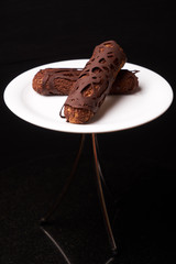 Decorated Chocolate eclairs with chocolate