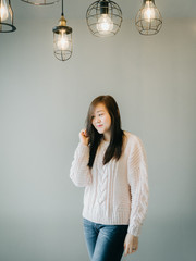 portrait concept from happiness and in love girl in knitting sweater at workplace and architecture...