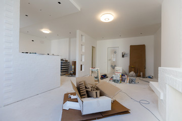 Home renovation in room full of painting tools