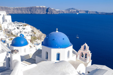 Santorini Oia Greece during vacation with a view at the white washed village with beautiful greek church