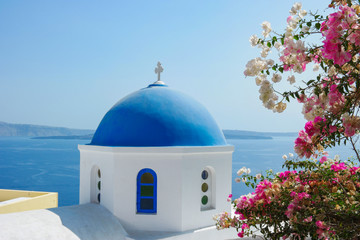 Santorini Oia Greece during vacation with a view at the white washed village with beautiful greek...