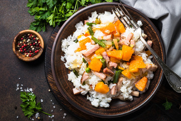 Risotto with pumpkin, vegetables and bacon.