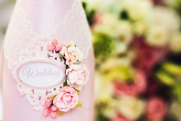 a bottle of pink color with a sign 