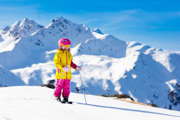 Fototapeta na wymiar Ski and snow fun. Kids skiing. Child winter sport.