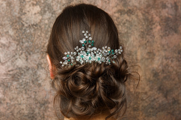 Naklejka premium Image from back of brunette with hairdo and diadem