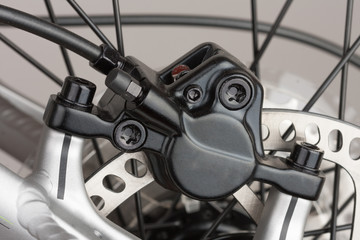 Naklejka premium Hydraulic rear disc brake of mountain bike, close up view, studio photo