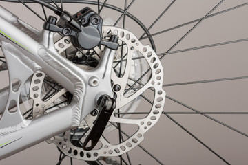 Fototapeta na wymiar Hydraulic rear disc brake of mountain bike, close up view, studio photo