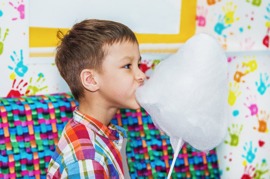 boy eating cotton candy