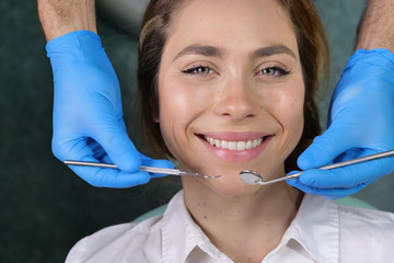 In a professional practice, a dentist checks the dentition of the patient, and she is happy with...