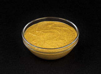 Mustard isolated on black background