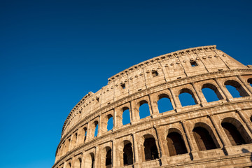 Fototapeta na wymiar View of Colosseum in Rome, Italy. Rome architecture and landmark. Rome Colosseum is one of the main attractions of Rome and Italy