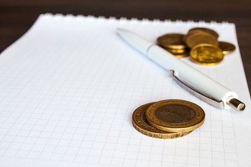 Close up shot of coins and pen