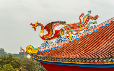 dragon on chinese temple roof in thailand