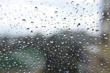 Naklejka na ściany i meble Drops of rain on the window, rainy day