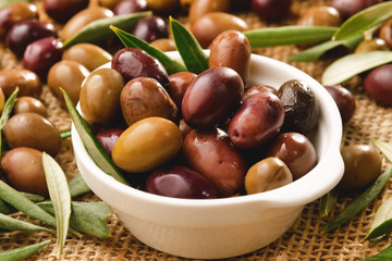 Genuine Italian olives organic oil cold pressed  falls. concept of nature and healthy food, healthy and natural. fresh olives and Tuscan Italian oil