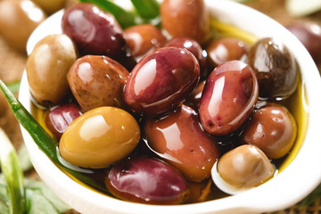 Genuine Italian olives organic oil cold pressed  falls. concept of nature and healthy food, healthy and natural. fresh olives and Tuscan Italian oil