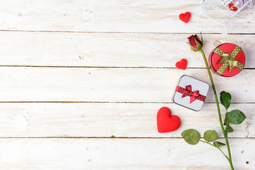 Red roses and gift box on old white wood table/Valentines day background with copy space