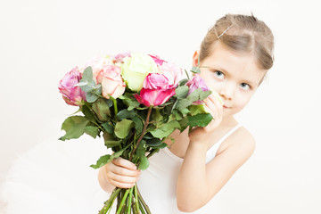 Obraz na płótnie Canvas little ballerina with bouquet